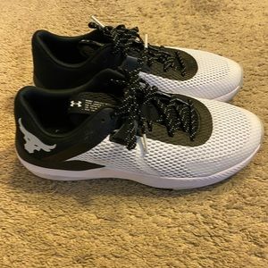 Black and white Under Armour shoes size 12.